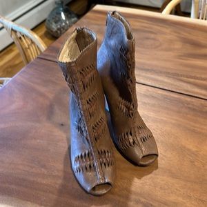 Unique leather bootie with a wedge style heel. Sam Edelman NYC boot size 8M.